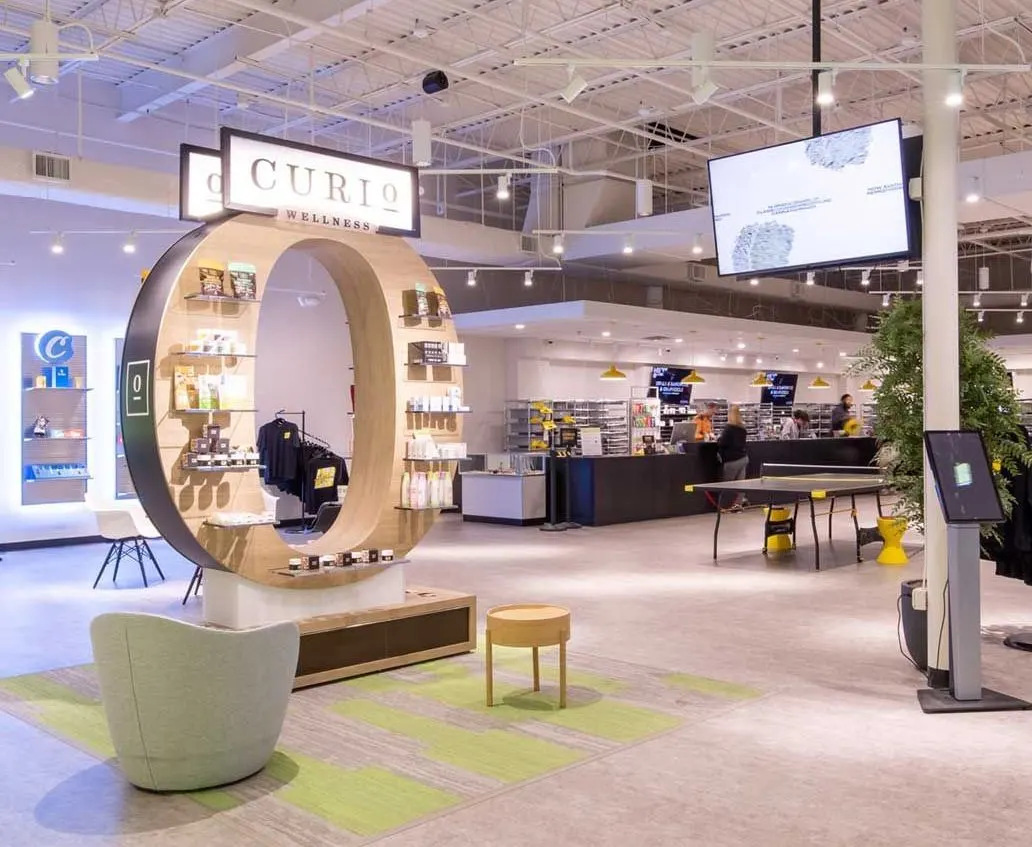 Modern cannabis dispensary interior with Curio circular display and lounge area